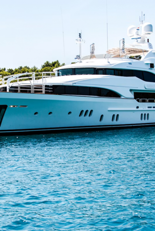 Sleek-black-and-white-yacht-docked-at-a-marina